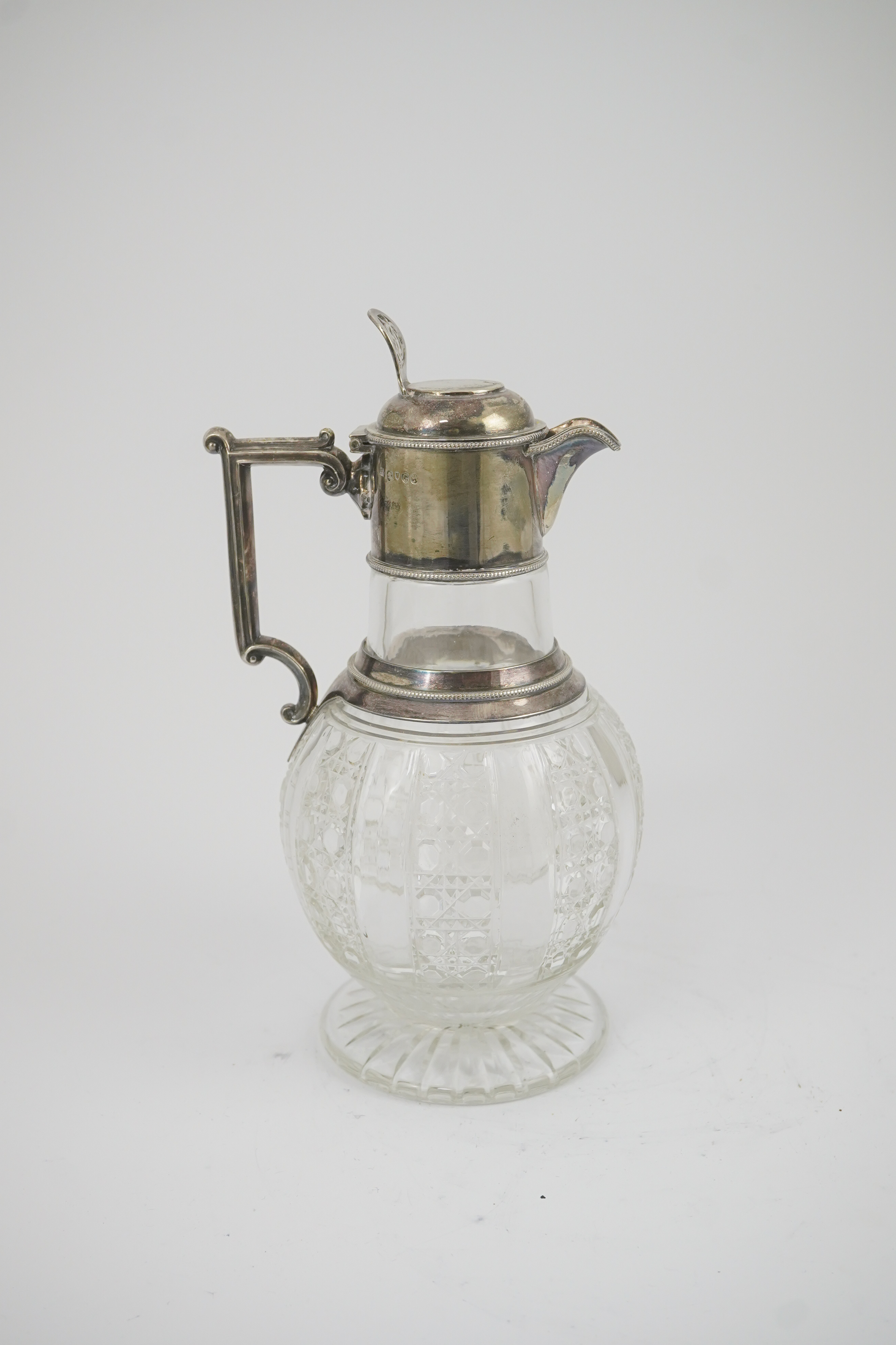 A late Victorian silver mounted cut glass claret jug, by Edward Hutton